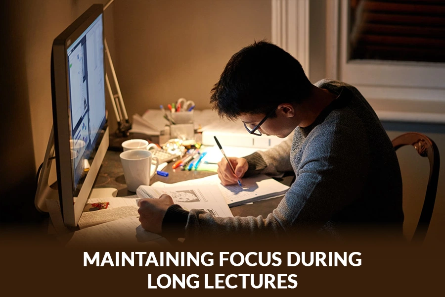 Student maintaining focus during long lectures by taking notes at a desk with books and a computer in a quiet study environment.